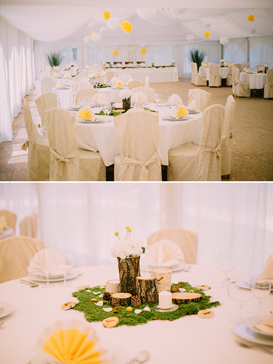 Elegant wedding reception with rustic centerpieces and white decor