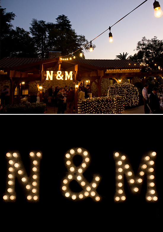 Lit up N & M letters at a wedding venue at night