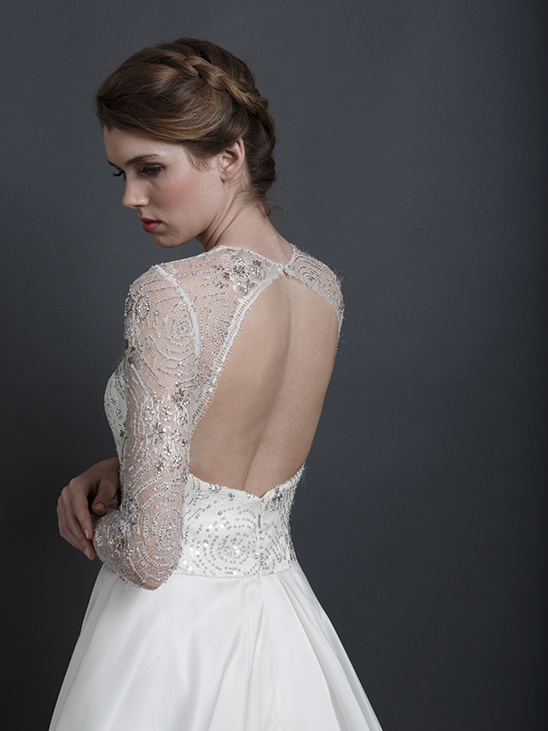 Elegant bride wearing a beaded wedding dress with back detail