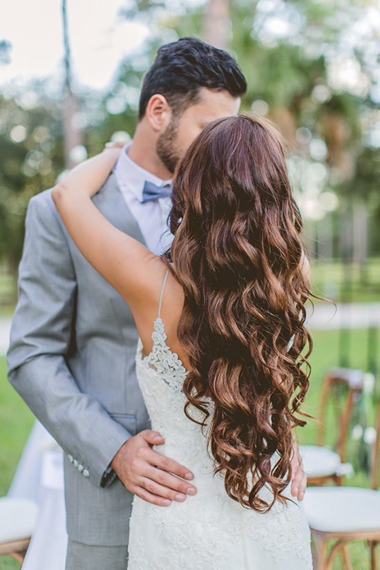 Bride and groom embrace in love on their wedding day