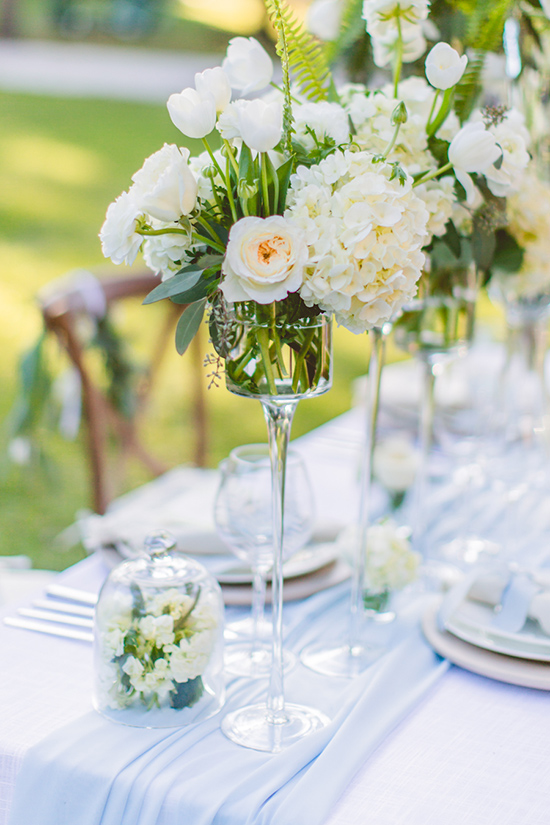 Elegant white floral centerpiece for a wedding table setting