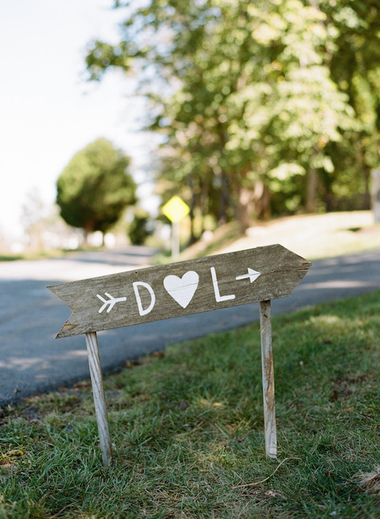 Handmade D L heart directional wedding sign outdoors