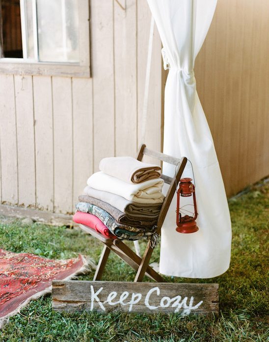 Cozy scene with blankets and a lantern, Keep Cozy sign