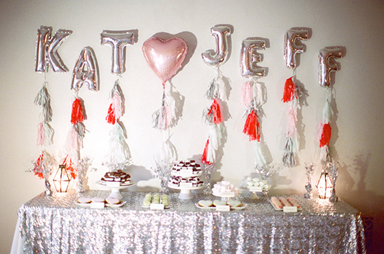 Kate and Jeff celebration party decor with balloon letters and sweets