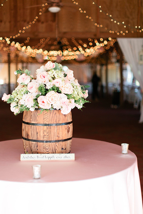 whiskey barrel with flowers @weddingchicks