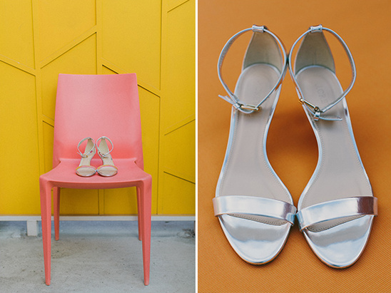 Silver and nude heels on pink chair and orange background
