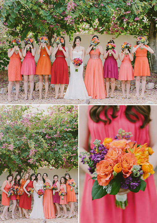 Bridesmaids in colorful dresses hide behind bouquets