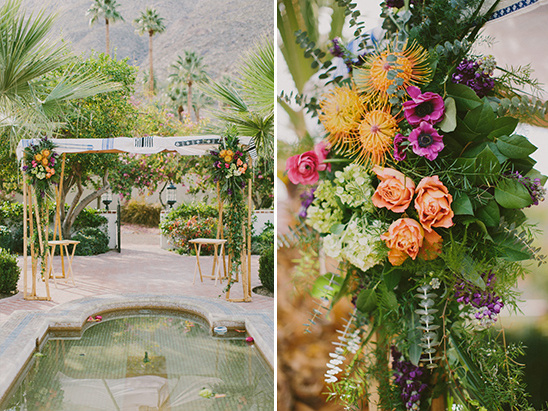 Wedding chuppah with flower arrangements and desert scenery