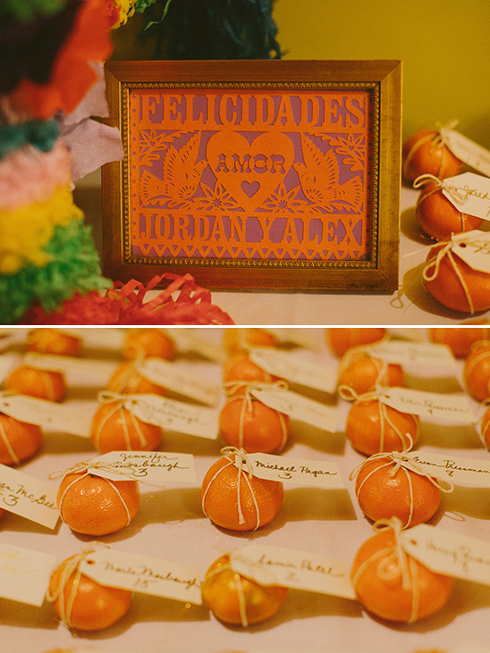 Mexican wedding decor papel picado and orange place cards