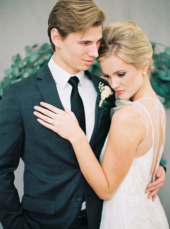 Elegant bride and groom embrace on their wedding day