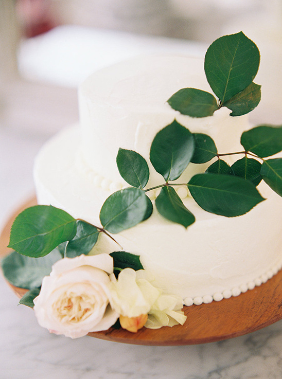 simple white wedding cake with flowers @weddingchicks