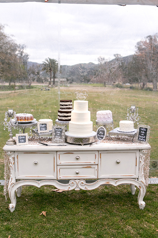 Wedding cakes display on a vintage buffet with nature background