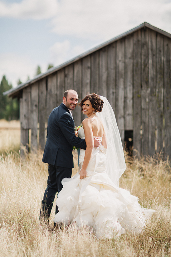 Happy couple walking towards camera on their wedding day