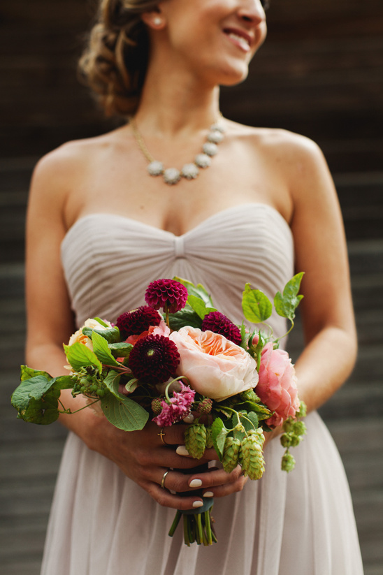 Bride holding a bouquet of colorful flowers on her wedding day