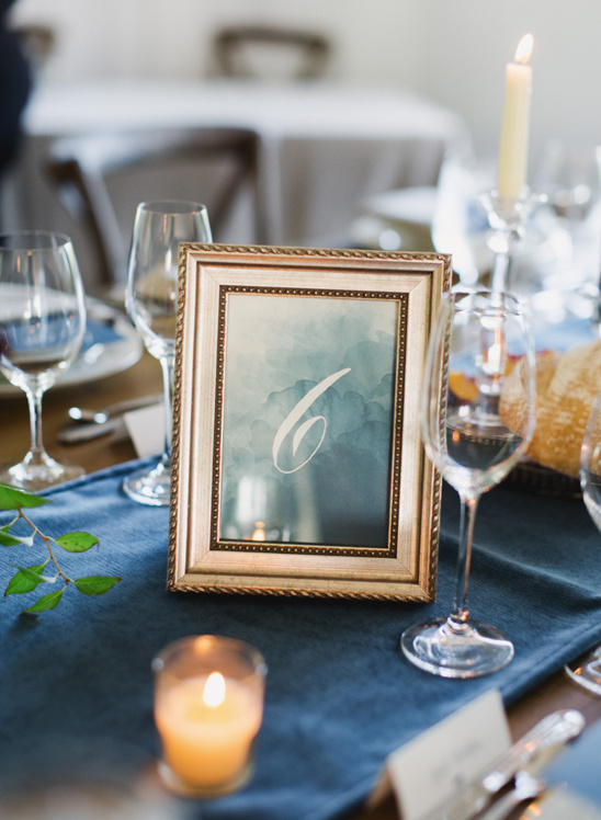 Elegant wedding table setting with a number six table sign