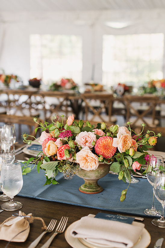 Elegant floral centerpiece on a beautifully set wedding table