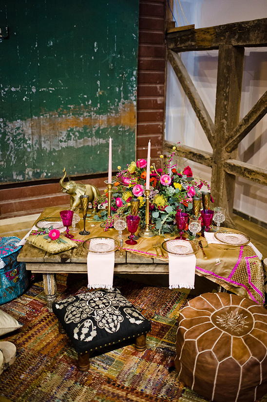 Bohemian styled table setting with floral arrangement and decor