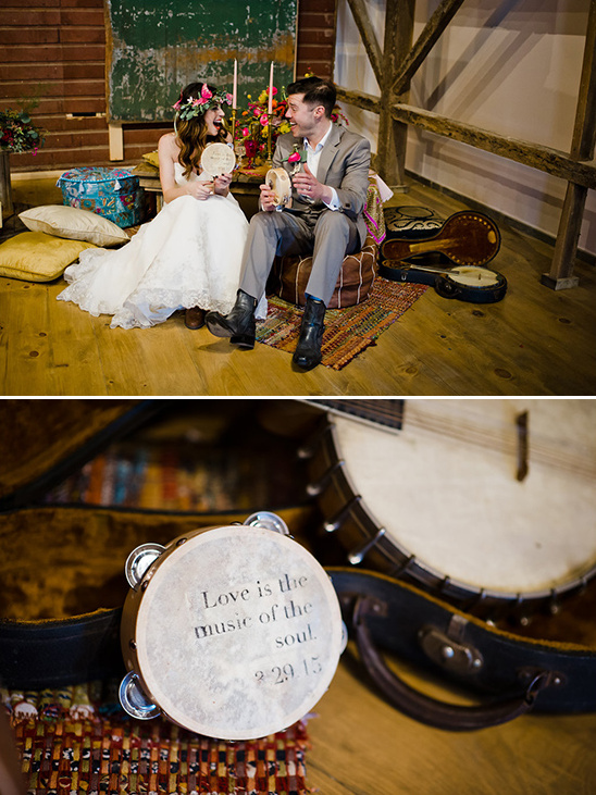 Boho wedding couple playing tambourines in a rustic setting