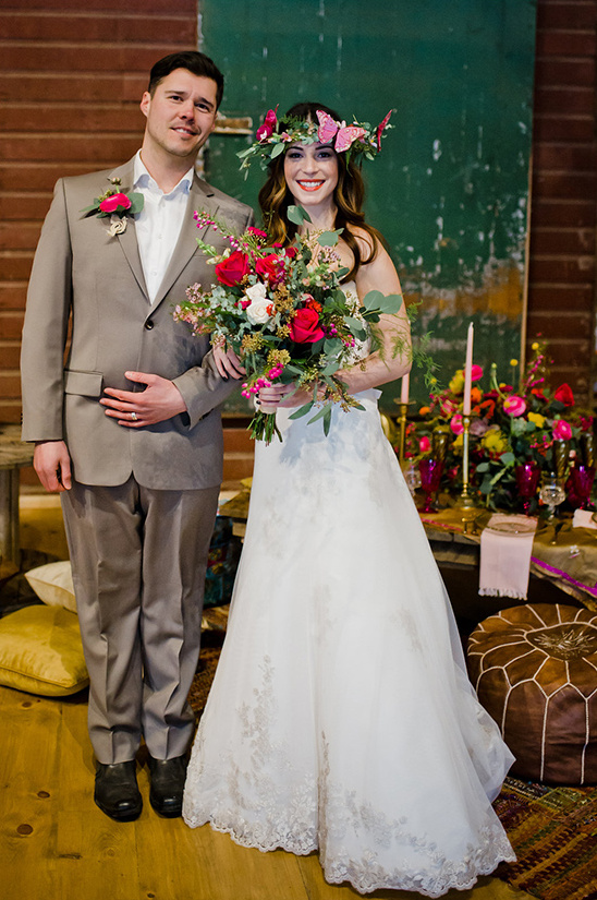 Happy couple on their wedding day posing for a photo