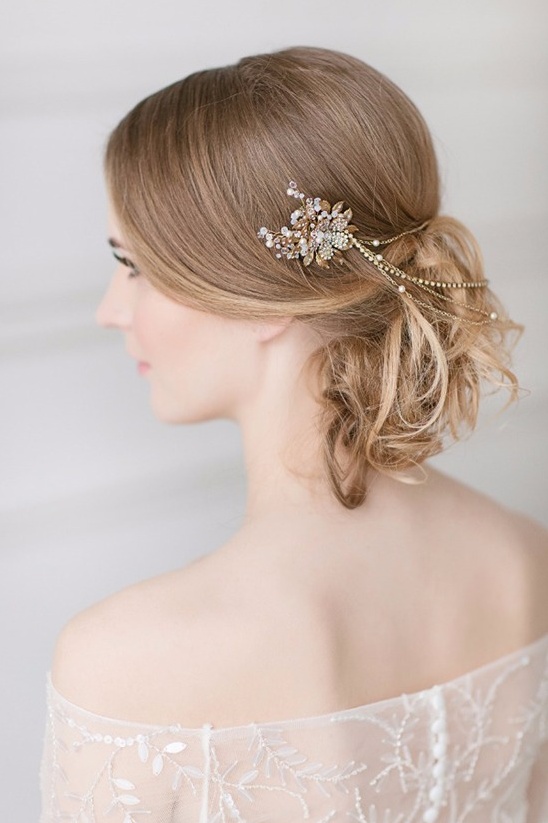 Elegant bride wearing a bejeweled hair accessory and wedding dress