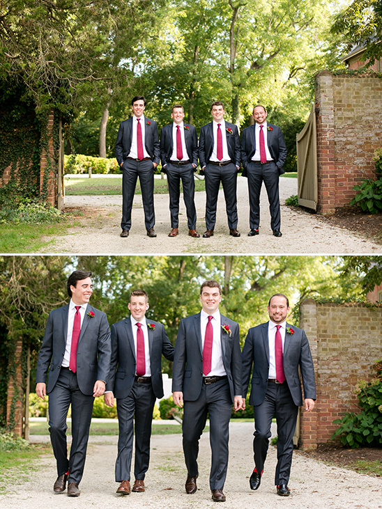 Groomsmen in gray suits and red ties at outdoor wedding