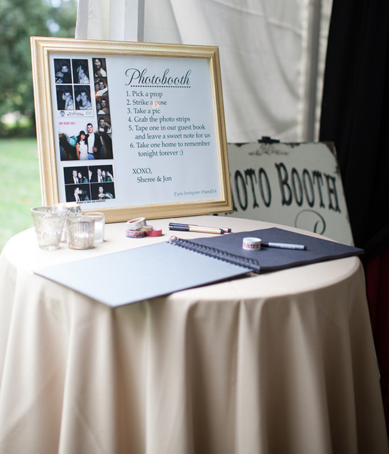 Wedding photobooth sign and guest book table setup