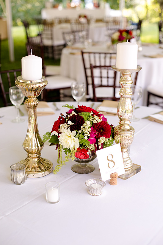 Elegant wedding table centerpiece with candles and flowers