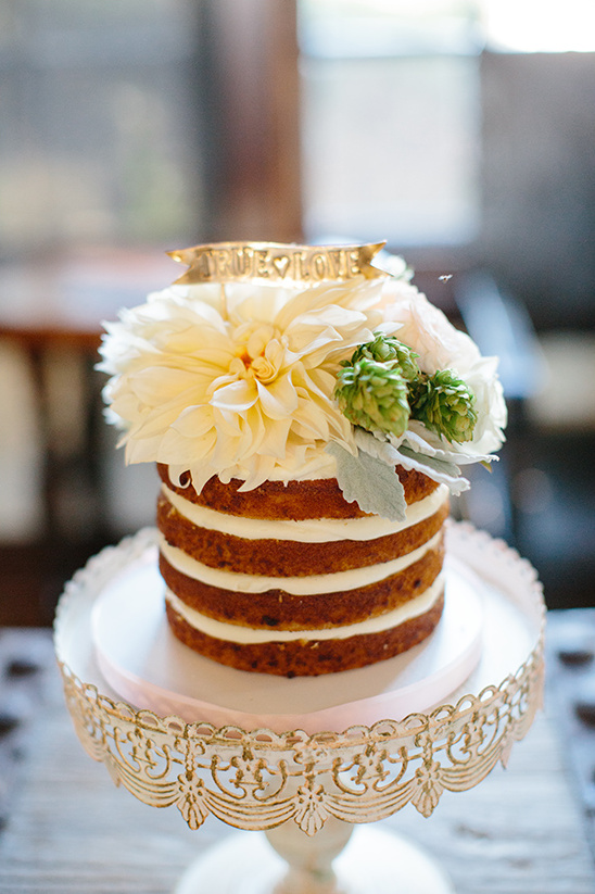 flower topped naked cake @weddingchicks
