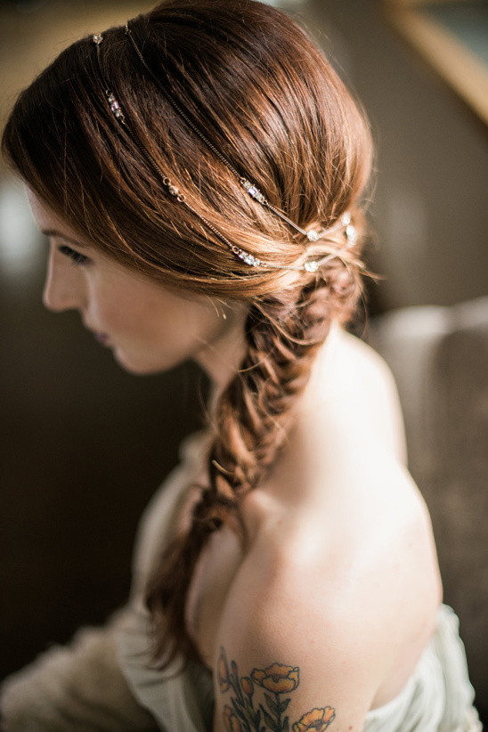 Woman with a fishtail braid and jeweled hair accessories