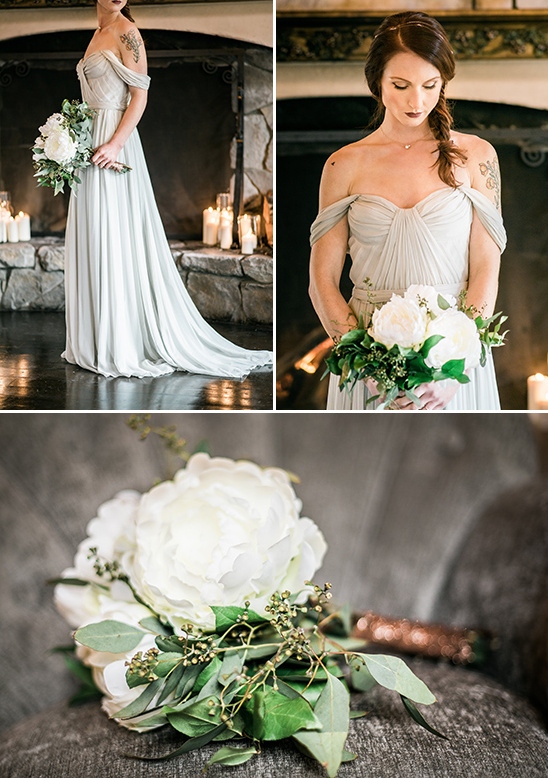 Elegant bride in flowing gray gown holding white bouquet