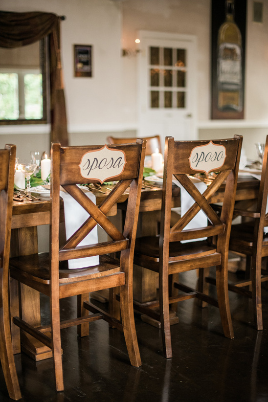Wedding reception chairs labeled bride and groom in Italian