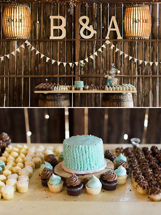Rustic wedding dessert table with cake and cupcakes
