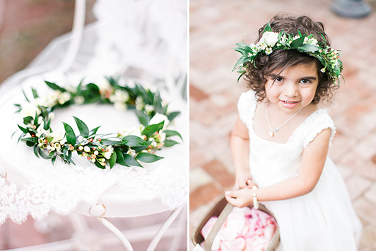 Flower girl wearing a floral crown, looking at the camera