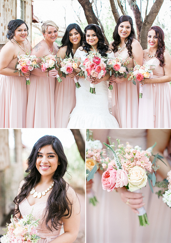 Bridesmaids in pink dresses hold bouquets near a bride