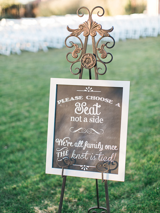 Wedding sign with a message to choose a seat not a side