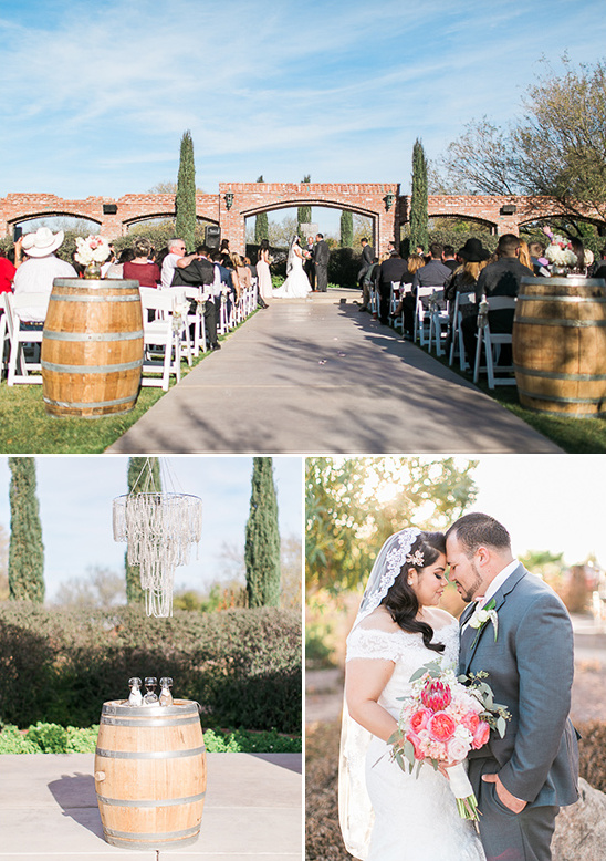 Wedding ceremony with barrel decorations under a bright blue sky