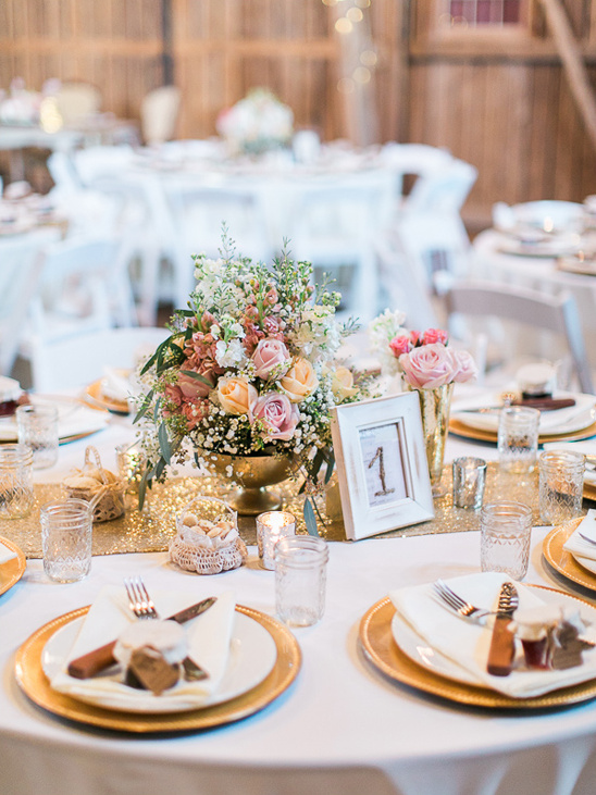 Elegant wedding reception table setting with floral centerpiece