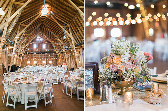 Rustic wedding reception setup inside a beautiful barn with flowers