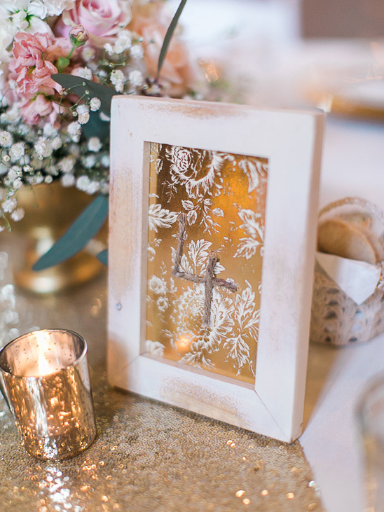 Rustic wedding table number four with floral decor