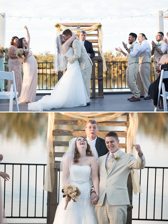 Joyful wedding couple sharing a kiss and celebrating their marriage