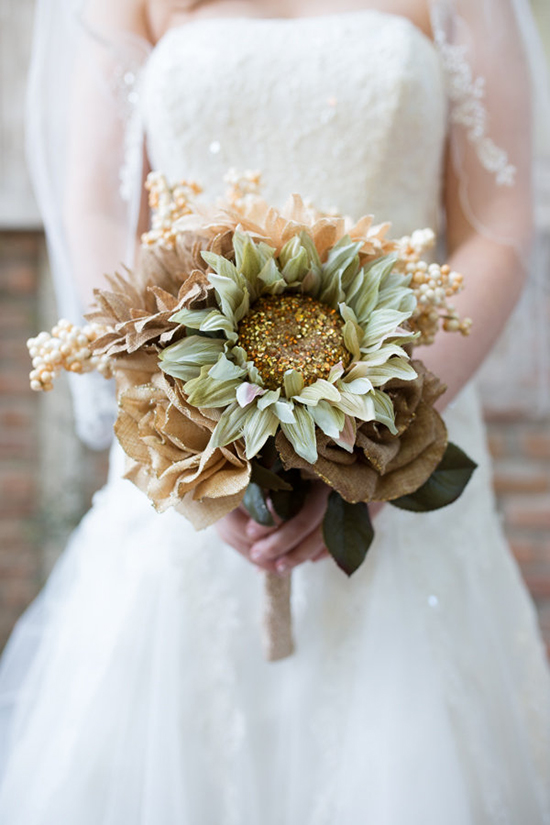 Bride holding a bouquet of unique brown and green flowers