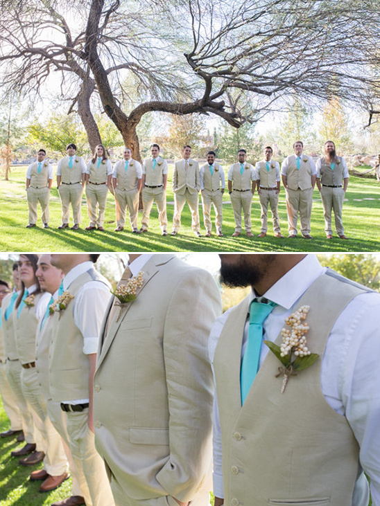 Groomsmen in tan suits and teal ties at an outdoor wedding