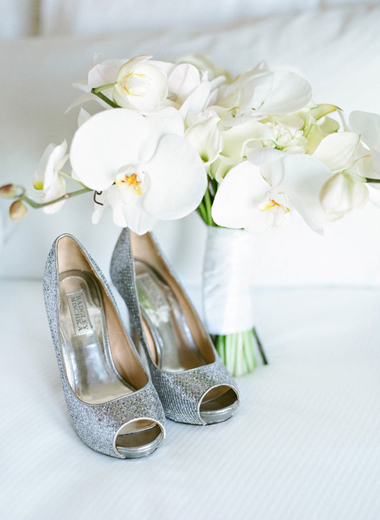 Silver glitter heels with white orchid bouquet for a wedding