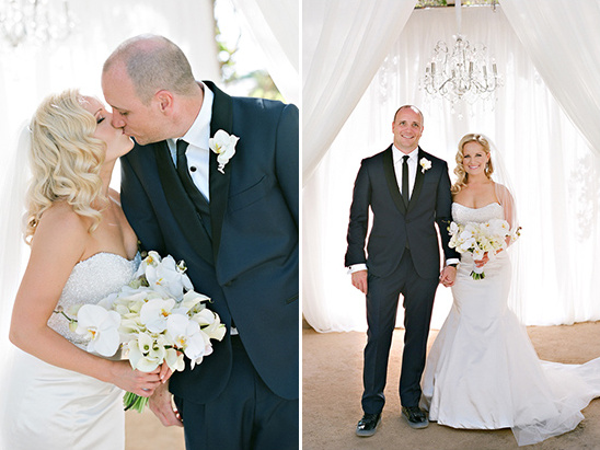 Elegant couple kissing and posing on their beautiful wedding day