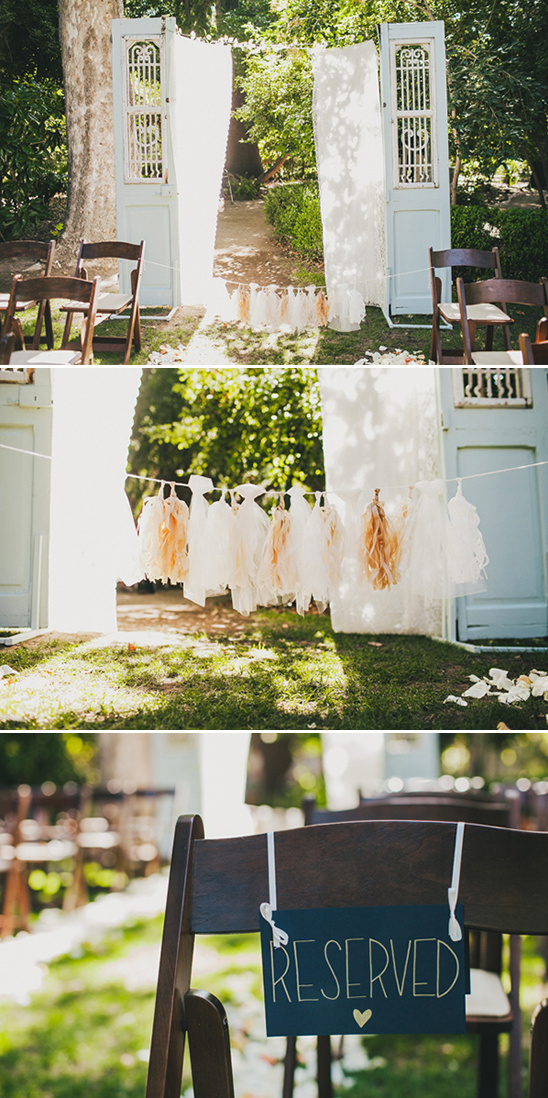 Wedding ceremony decor with doors and reserved seating