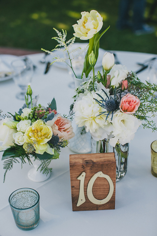 Elegant wedding table with flower arrangements and table number ten