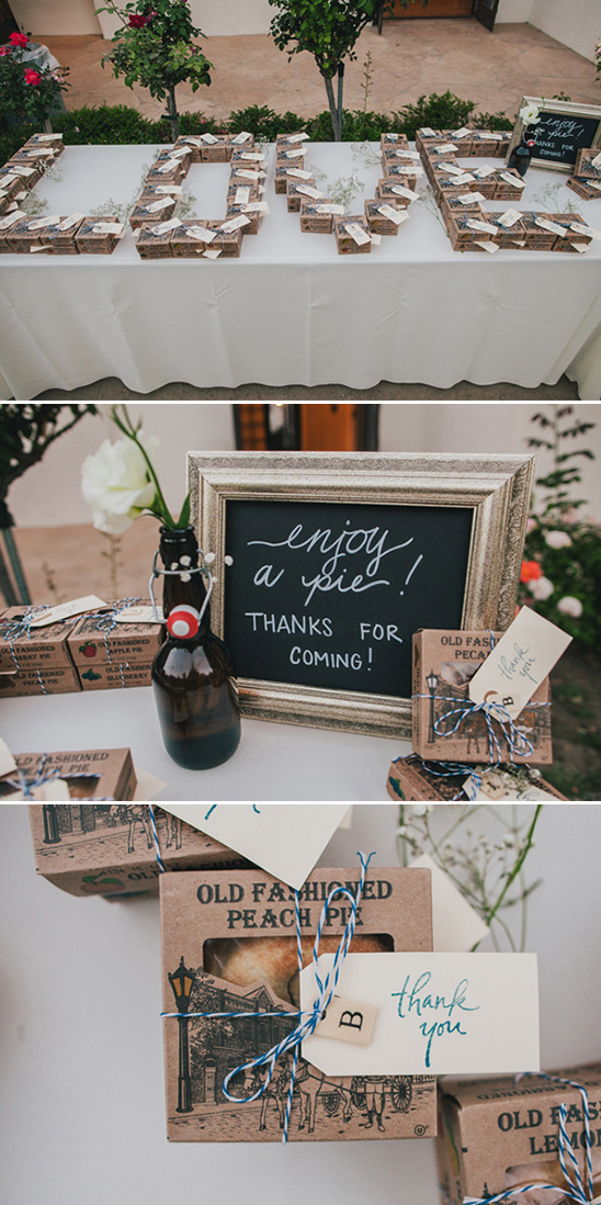 Wedding decor with love sign and pie favors for guests