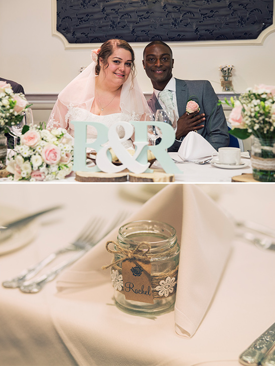 Happy couple at the wedding table with a jar named Rachel