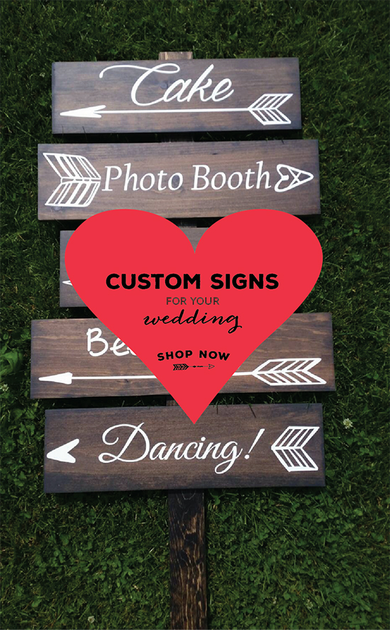 Wooden wedding signs with arrows pointing to cake photo booth and dancing!