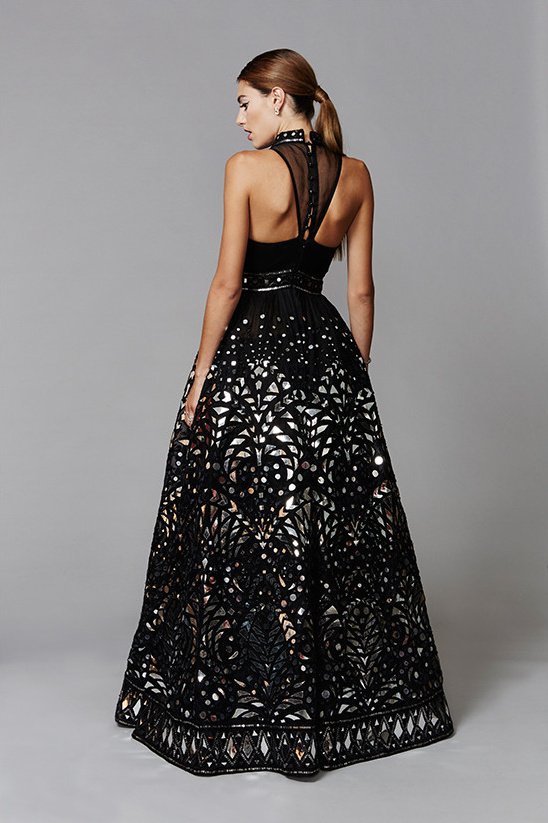 Woman in a stunning black and silver embellished formal gown